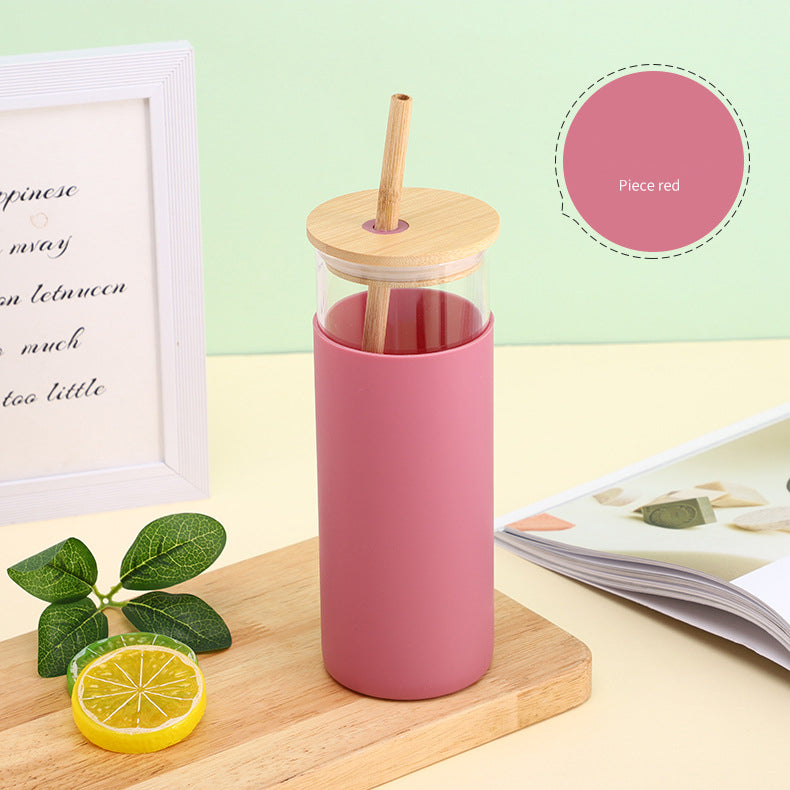 Shishe qelqi me kapak bambuje dhe pipë druri