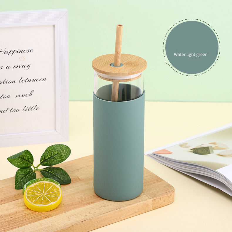 Shishe qelqi me kapak bambuje dhe pipë druri